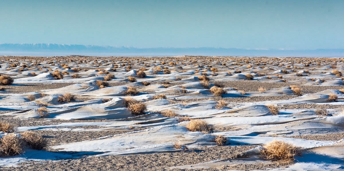 Snow piled up on a desertified land of Mongolia