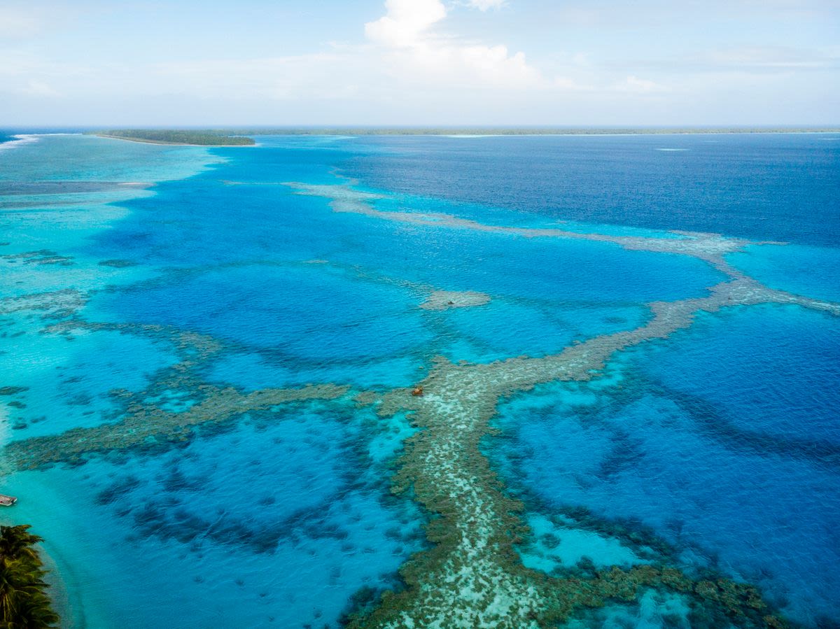 Children playing in the water, Carteret Islands, Papua New Guinea. 
