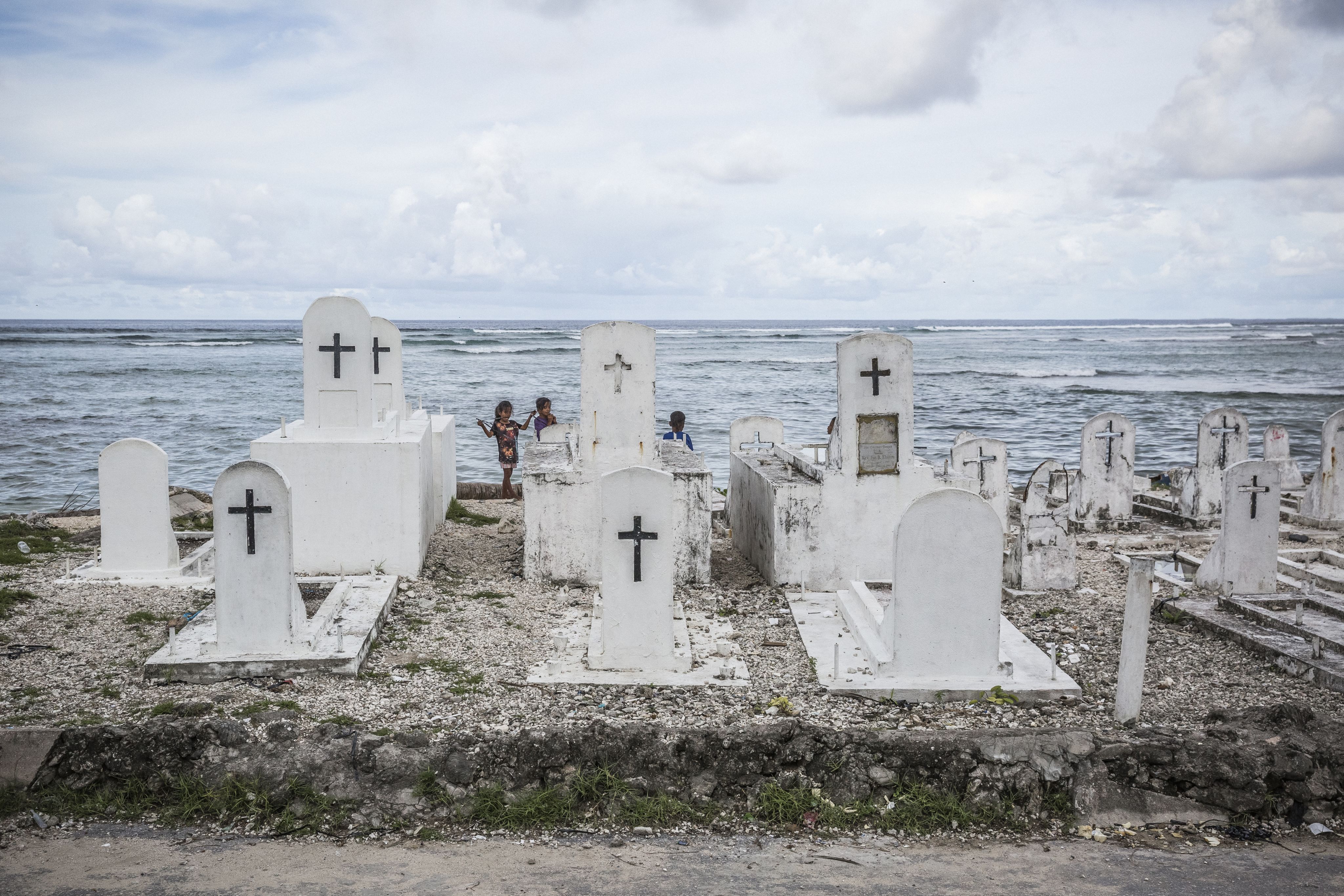 Gravestones at the eroding seaside in Marshall Islands.